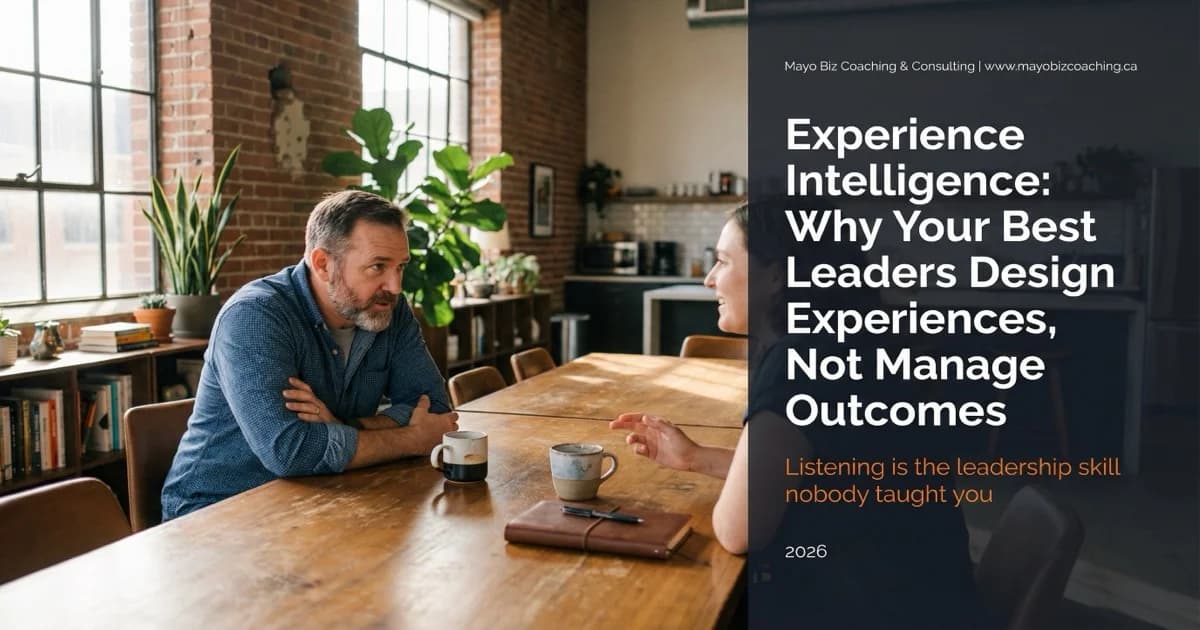Business coach listening attentively to a team member in a warm modern office with morning light